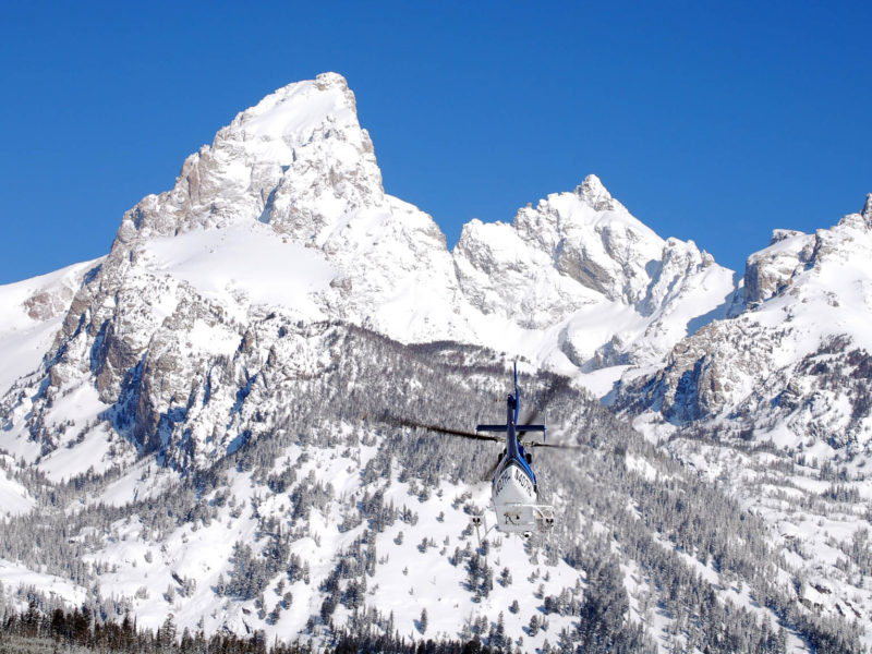 A helicopter heads toward Garnet Canyon in this file photo from April 2011 taken during a search for two lost skiers in Grand Teton National Park. Two snowboarders were rescued Feb. 13 after mistakenly riding into Granite Canyon. (National Park Service photo by Jackie Skaggs — click to enlarge)