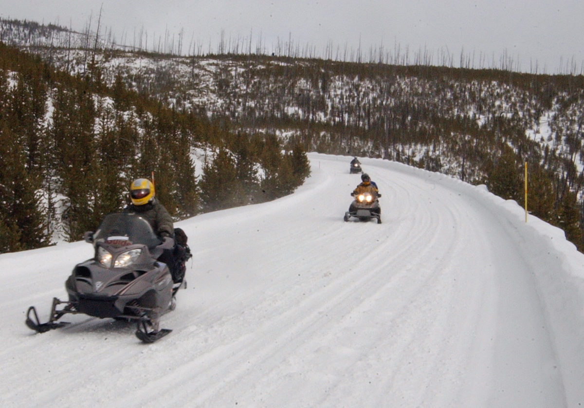 Commercial snowmobile guide John Davis leads visitors through Yellowstone National Park during a 2007 day trip.