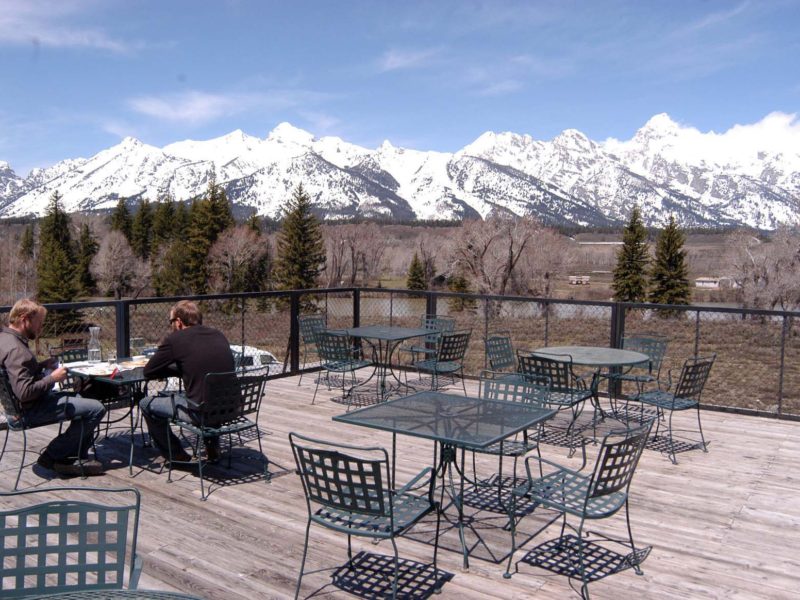 Jason Lesli, left, and Duane Nardi have lunch on the rooftop deck of Dornan's restaurant in May 2011 in Grand Teton National Park. (Ruffin Prevost/Yellowstone Gate)