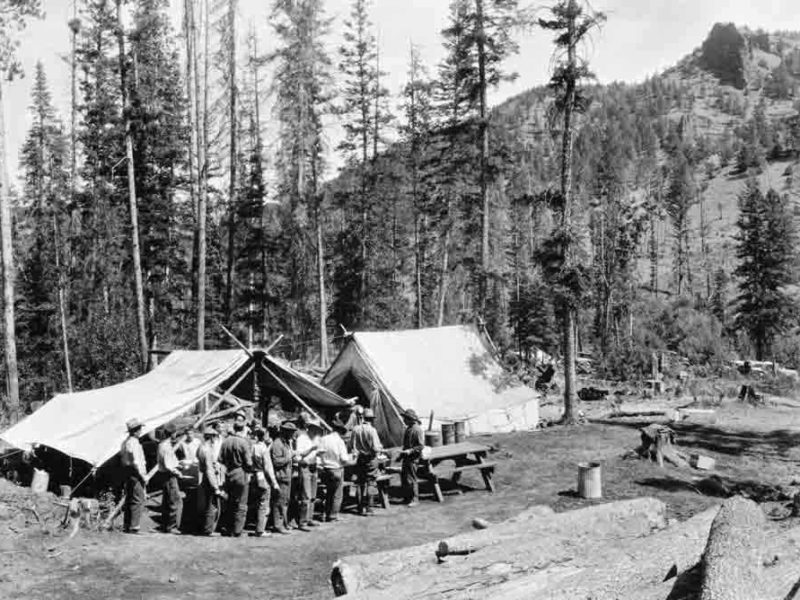 Firefighters move through a chow line during the 1937 Blackwater Fire east of Yellowstone National Park. Fifteen firefighters were killed in the blaze, and a series of events are scheduled for the 75th anniversary of the blaze. (Jack Richard photo courtesy of Buffalo Bill Historical Center McCracken Research Library PN.89.114.21398.4)