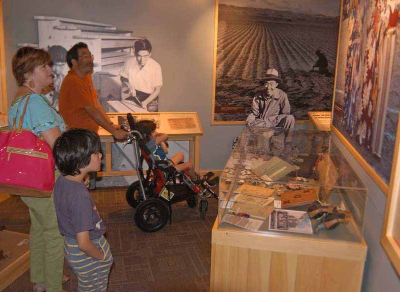 Brooke Wayne, left, Yuji Tsuno and their sons St. John, left, and Ruffin visit the Heart Mountain Interpretive Center east of Yellowstone National Park. (Ruffin Prevost/Yellowstone Gate - click to enlarge)