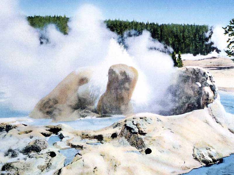 A postcard by historic Yellowstone National Park photographer Frank Haynes shows Grotto Geyser as it appeared in approximately 1913. (click to enlarge)