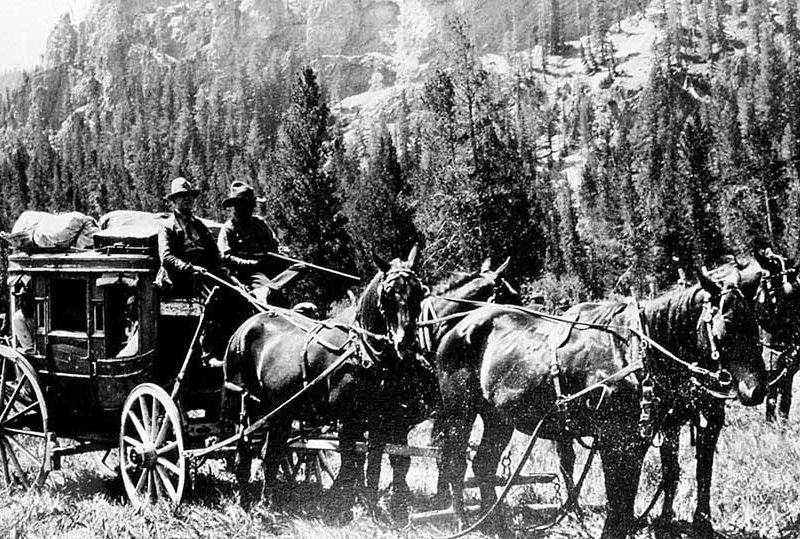 Horse-drawn coaches were the common method for travel in the early days of Yellowstone National Park. (Yellowstone Digital Slide File - click to enlarge)