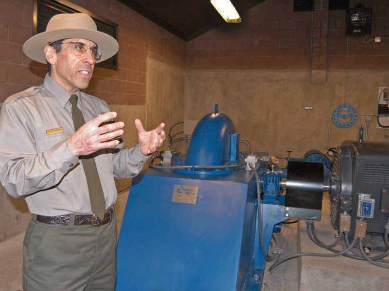 Peter Galindo, a project engineer for Yellowstone National Park, discusses a new small-scale hydro-electric power system now in use near Mammoth Hot Springs. (Ruffin Prevost/Yellowstone Gate - click to enlarge)