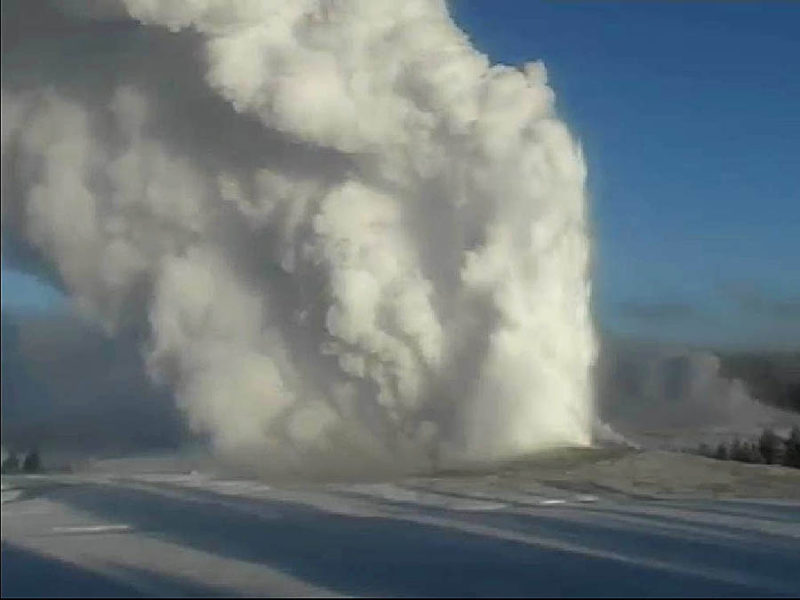 Old Faithful Geyser erupts on the morning of Dec. 19 as seen from the National Park Service webcam.