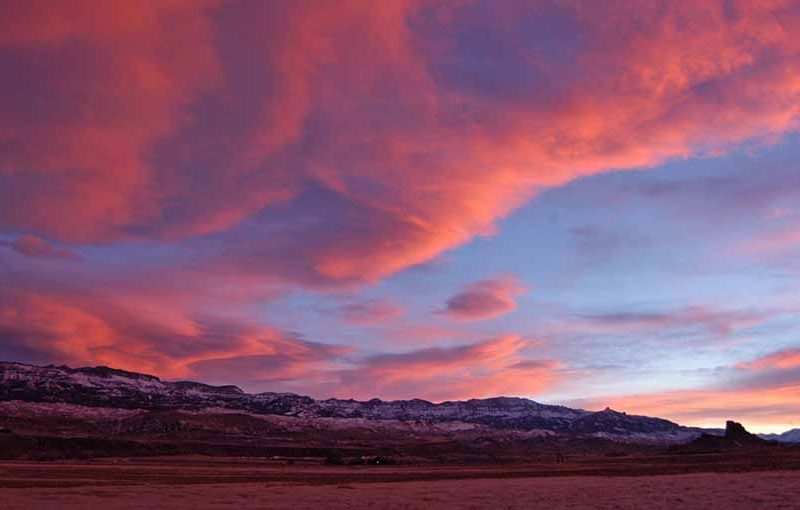 The sun sets over Carter Mountain with Castle Rock visible on the right in the South Fork Valley near Cody, Wyo. (Ruffin Prevost/Yellowstone Gate - click to enlarge)