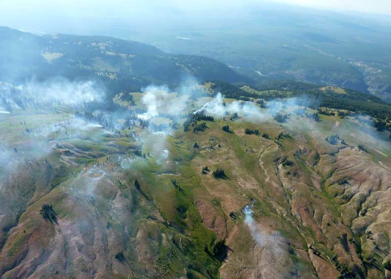 Fire danger in the Teton area has lessened after recent rain, including around the Snake Fire, which straddles the border of Yellowstone and Grand Teton national parks.