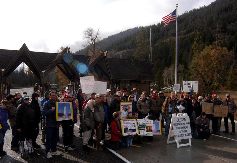 Protestors gather at the East Gate to Yellowstone National Park on Sunday to demand a solution to the federal government shutdown that has closed national parks nationwide.