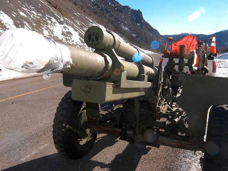 Yellowstone National Park maintenance worker Eric Holdren works last month to prepare a howitzer for use this winter in avalanche mitigation along Sylvan Pass. (Ruffin Prevost/Yellowstone Gate)