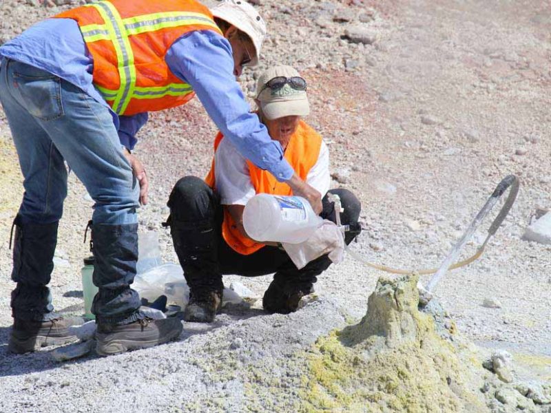 Researchers collect gas samples form a fumarole in Yellowstone National Park as part of a study aimed at learning more about the processes at work beneath the park's thermal features.