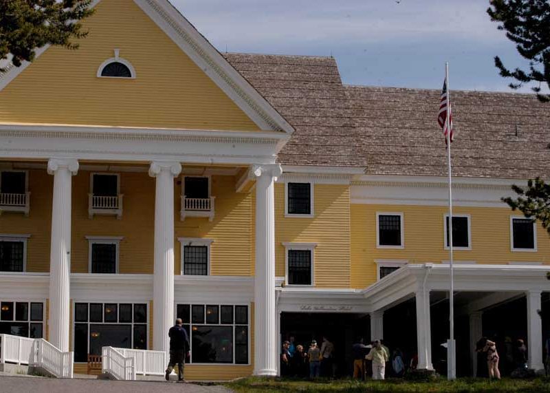 People gather Tuesday for a ribbon-cutting celebrating completion of a 2-year, $28.5 million renovation of Lake Hotel in Yellowstone National Park.