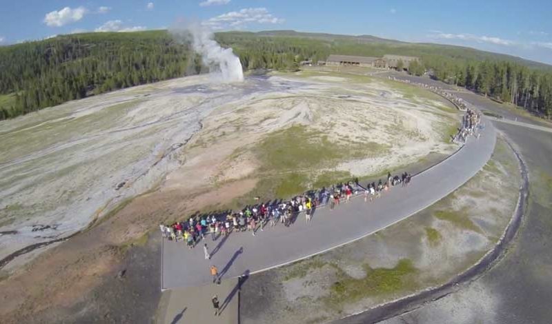 A still image from a video posted to YouTube shows Old Faithful erupting as seen from a camera drone in 2013, before Yellowstone National Park and the National Park Service banned unmanned aerial vehicles.