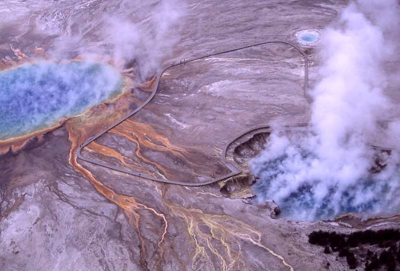 Steam rises from Excelsior Geyser Crater and Grand Prismatic Spring in Yellowstone National Park.