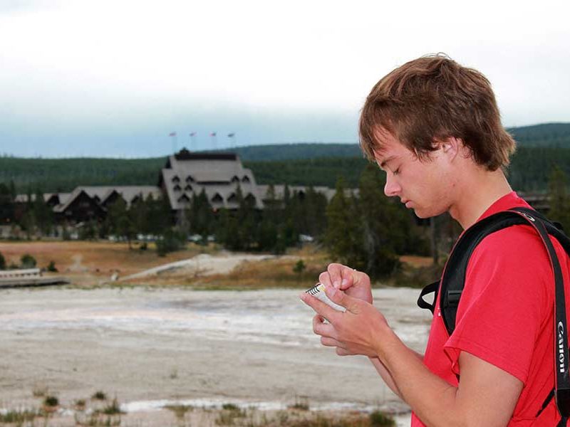 Self-described 'geyser gazer' Ryan Maurer takes notes after the eruptions of Lion Geyser in Yellowstone National Park.