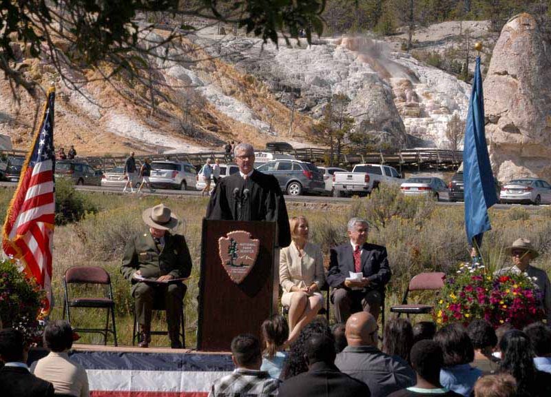 U.S. Magistrate Judge for the District of Wyoming Mark Carman speaks to new citizens after administering their naturalization oath Sept. 3 in a ceremony at Mammoth Hot Springs in Yellowstone National Park.