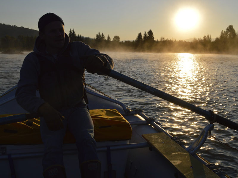 The sun rises over the Snake River in Grand Teton National Park.