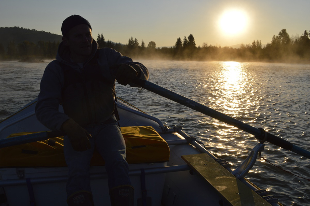 The sun rises over the Snake River in Grand Teton National Park.