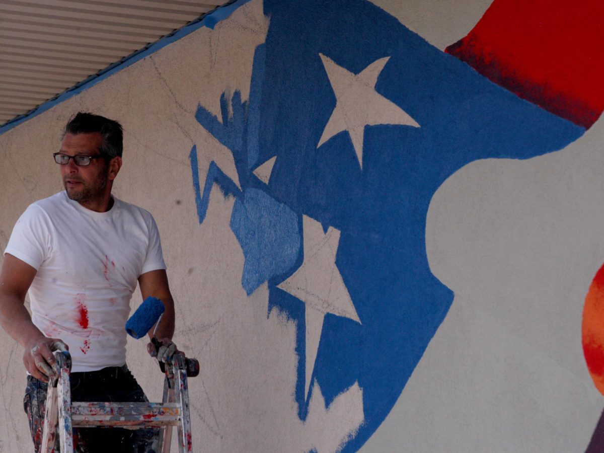 Artist Scott LaBaido is painting American flag murals on veterans' posts in all 50 states, including one in Cody, Wyo.