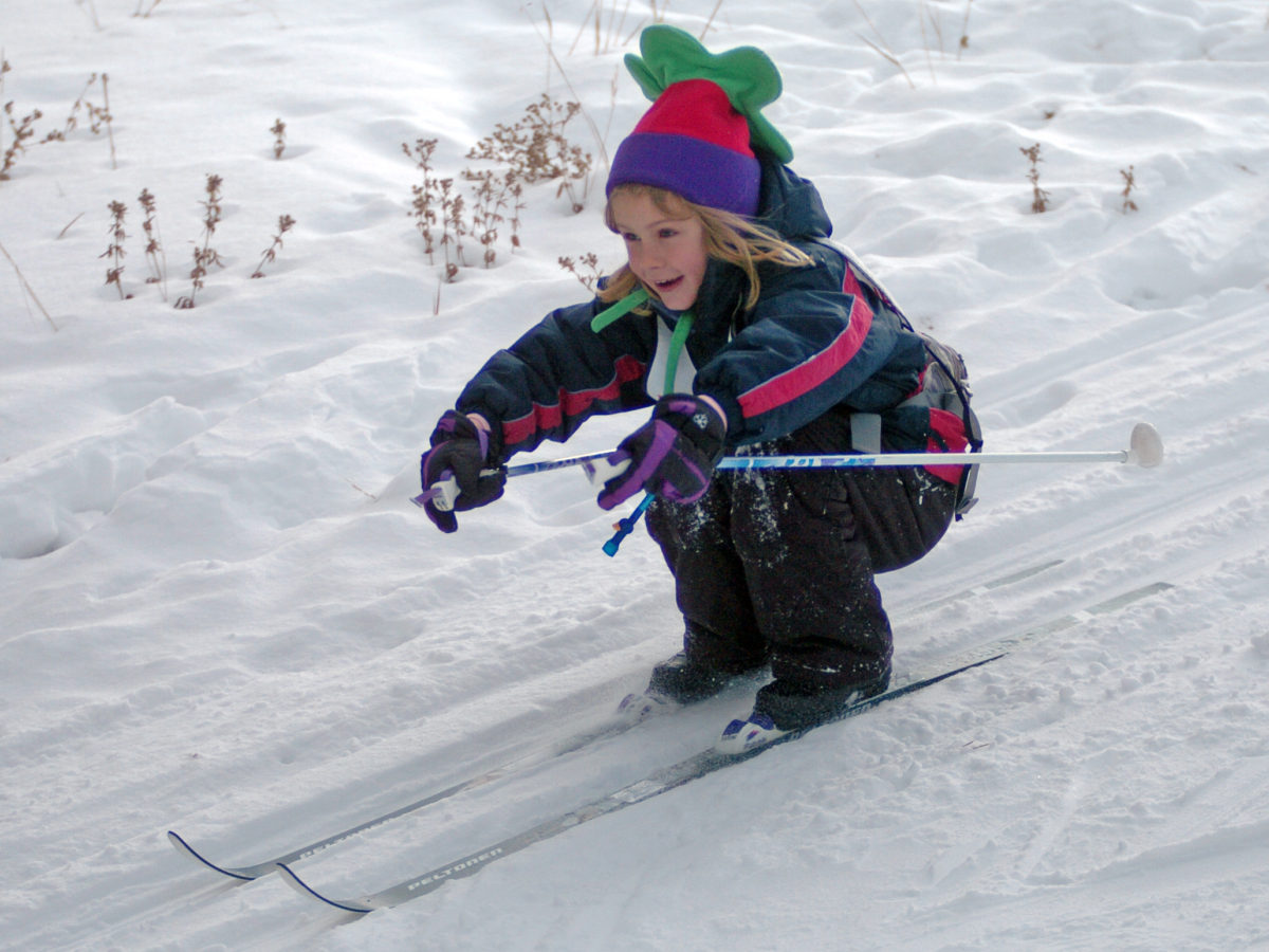 Simona Wambeke glides down a hill during a kids' nordic ski clinic at Pahaska Tepee near the East Gate to Yellowstone National Park.