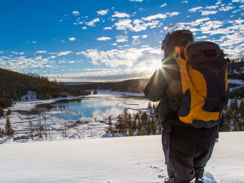 A visitor to Yellowstone National Park stops to take in the snowy view.